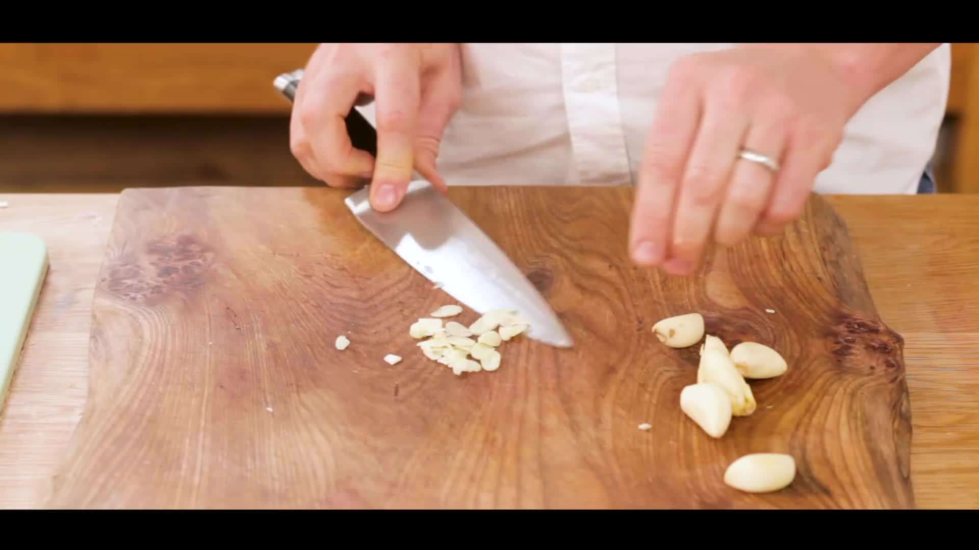 Jamie showcasing the cross chopping method for garlic
